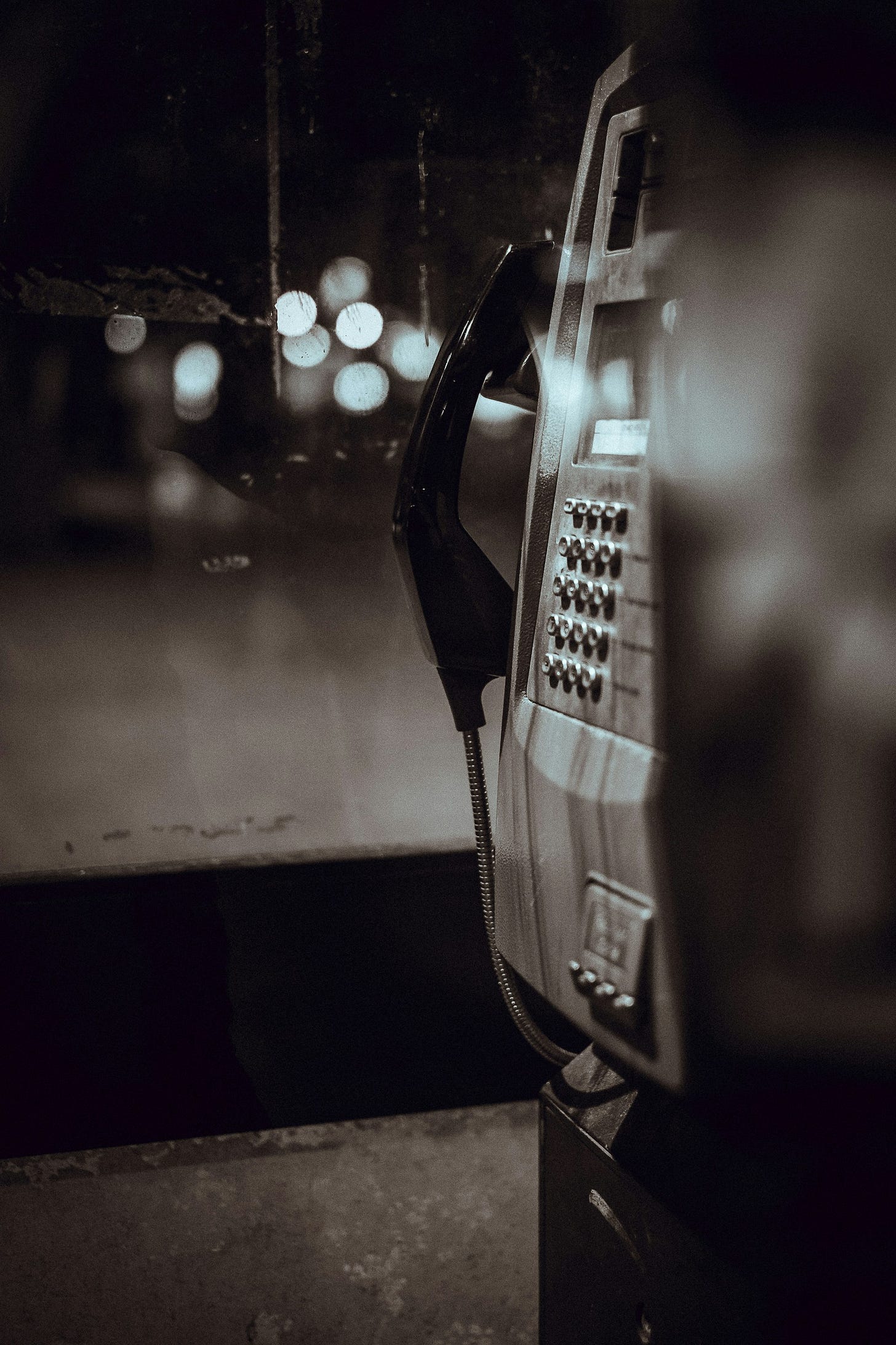 Payphone black and white. Photo credit: Clem Onojeghuo