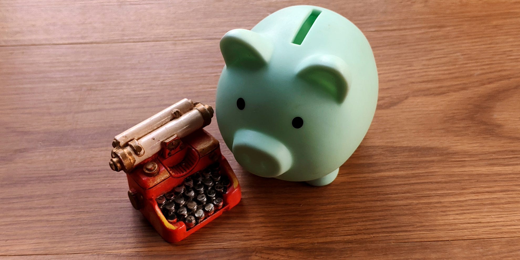 Piggy bank and typewriter representing going paid on Substack. Piggy bank and typewriter representing going paid on Substack.