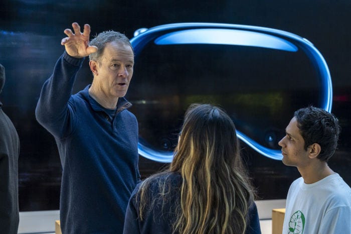 Apple executive demonstrating the Vision Pro headset.