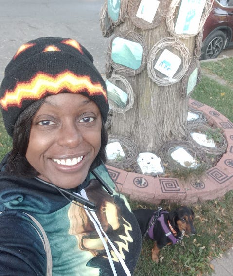 Dog owner and dog wearing Halloween festive attire Dog owner and dog wearing Halloween festive attire