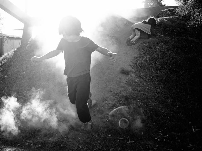 Child running in the dust from iStock-21822681