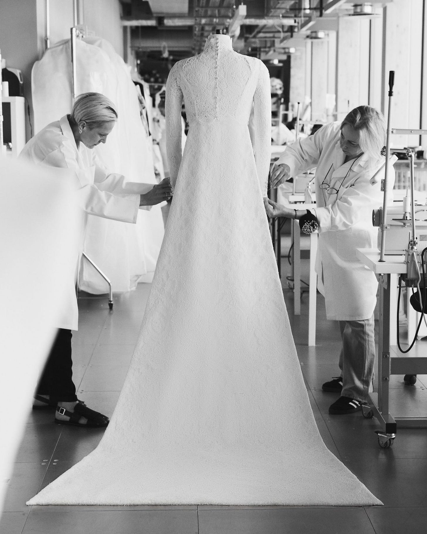 Image may contain Clothing Dress Fashion Formal Wear Gown Wedding Wedding Gown Adult Person and Architecture