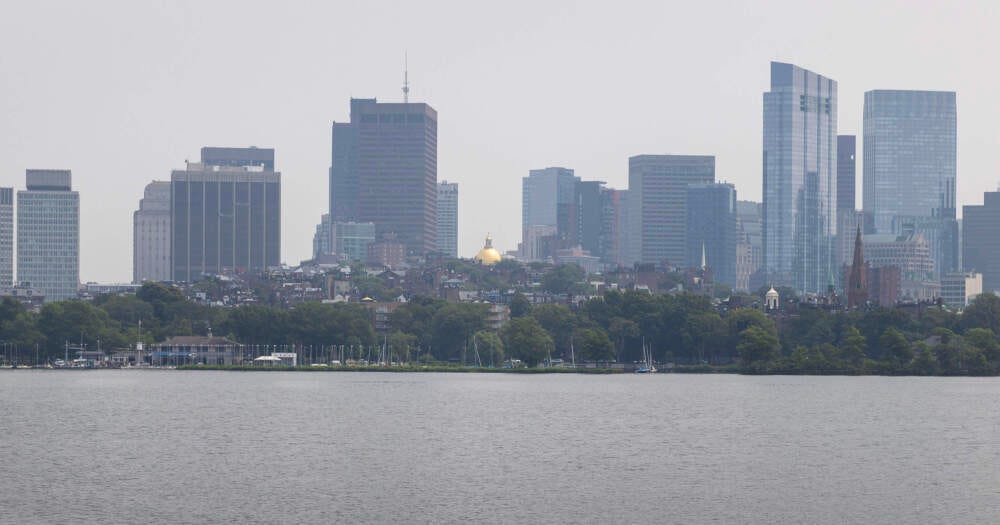 Haze caused by Canadian wildfire smoke hangs over Boston on an August day in 2025. (Robin Lubbock/WBUR)