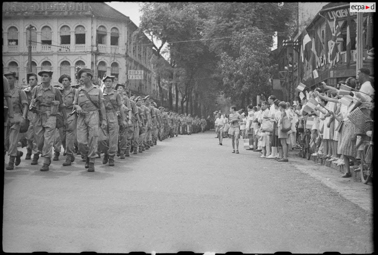 October 4th, 1945: European colonists celebrate the French 5th Colonial Infantry Regiment's arrival in Saigon, reestablishing control over Vietnam after WWII.