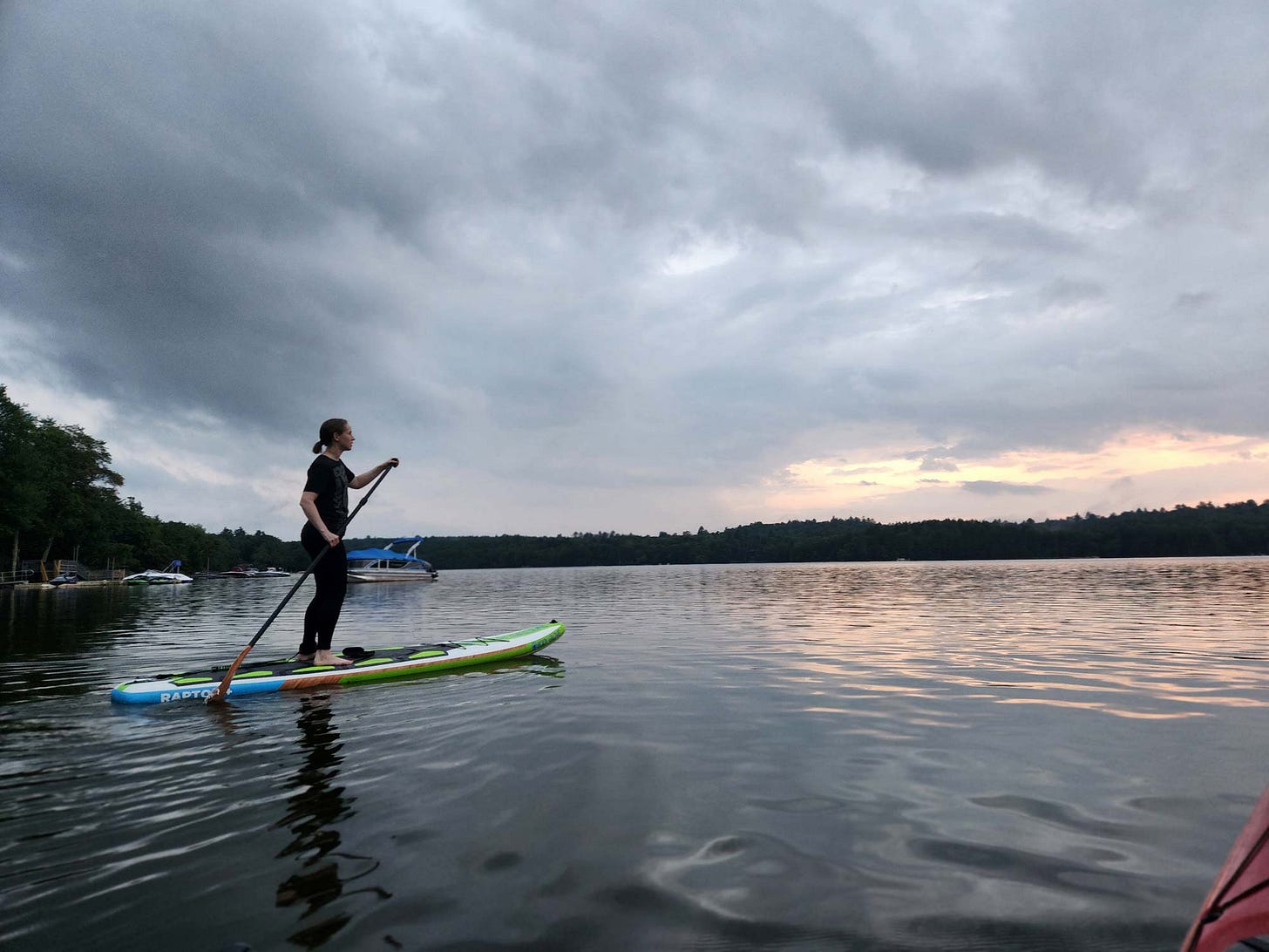 K. Woodman-Maynard is going paddleboarding on a lake in Catskills.