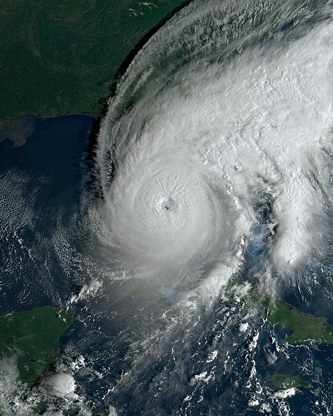 A satellite view of a hurricane

Description automatically generated