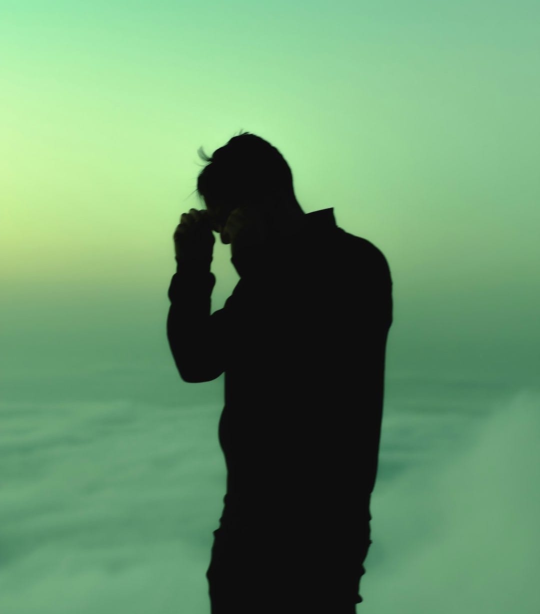 a person standing in front of a bright light