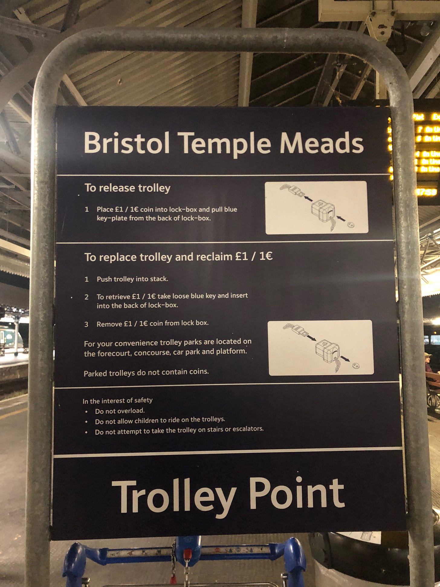 A Photo of the trolley parking system at Bristol Temple Meads Station, which includes instructions.