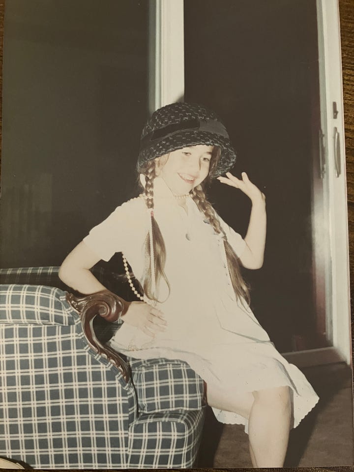 Courtney playing dress up