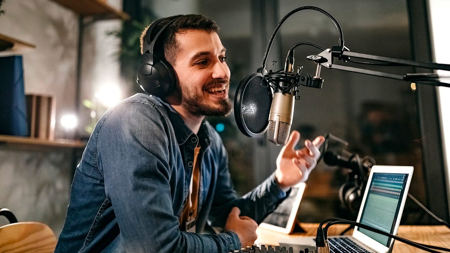 man podcasting