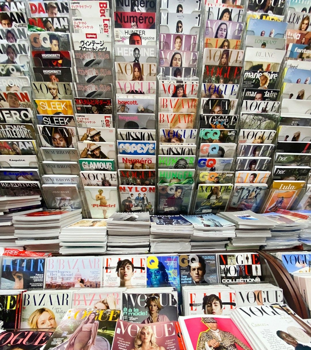 Magazines are neatly displayed in a shop.