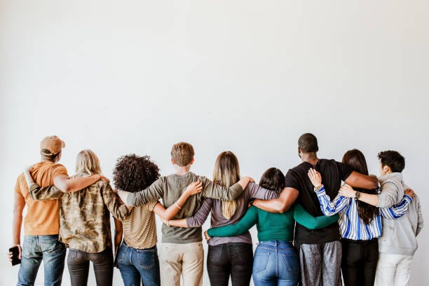 Rearview of diverse people hugging each other Rearview of diverse people hugging each other people stock pictures, royalty-free photos & images