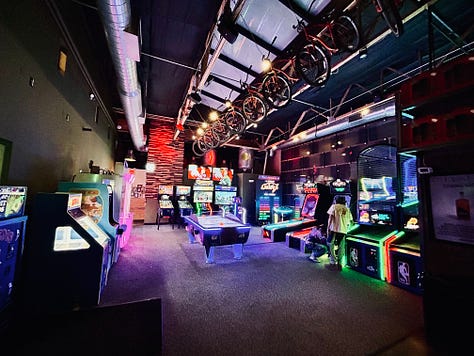 arcade, darts, chairs, tables