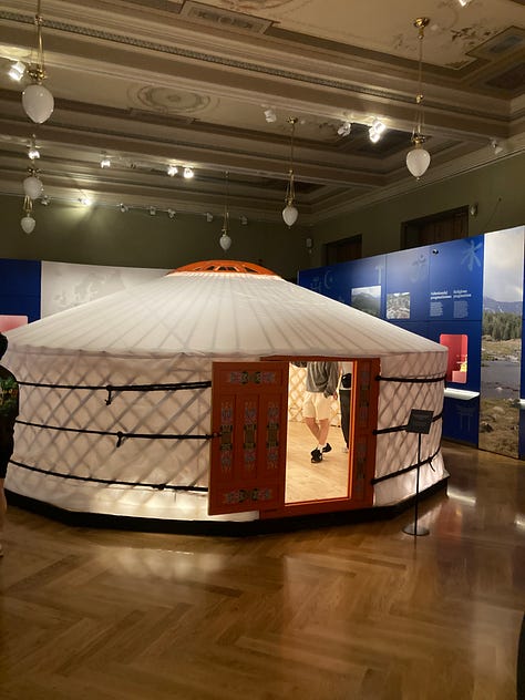 Pictures of a ceramic camel, a pizza, the seal of a General, a Garuda mask, a yurt, a lovely lady looking at a Yama, a map, and a timeline.