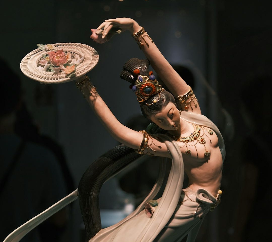 Elegant porcelain statue of a dancing woman.
