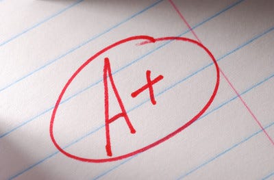 A circled A+ written in red marker A circled A+ written in red marker