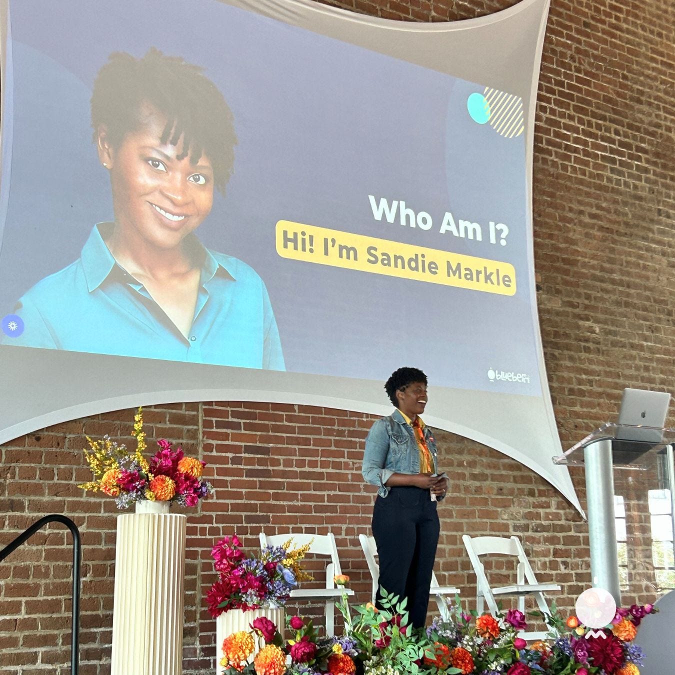 woman speaking on the stage
