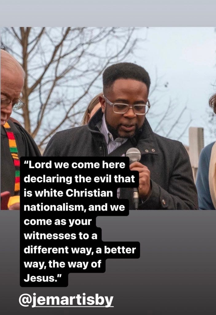 Photo of Jemar praying outside in front of the capitol
