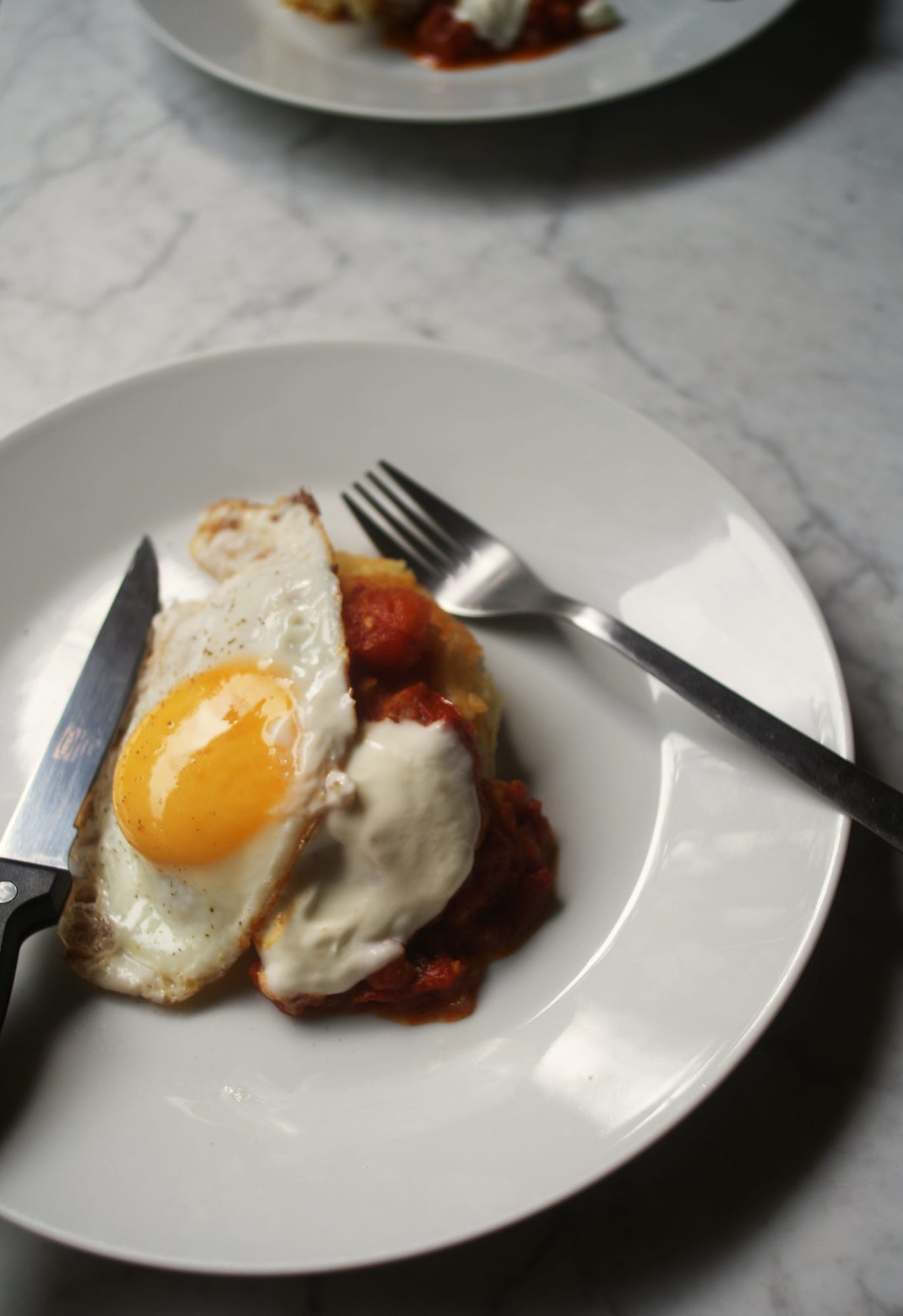 Mashed potato cakes and fried eggs