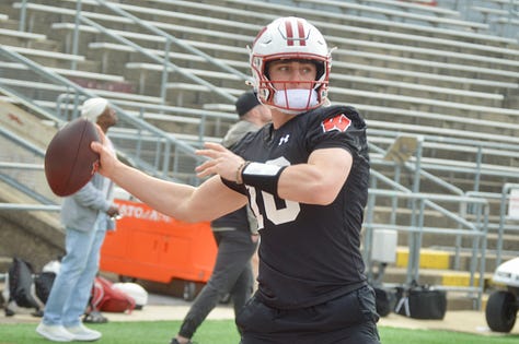 Wisconsin quarterbacks participate in individual position drills during Saturday's spring practice inside Camp Randall Stadium.