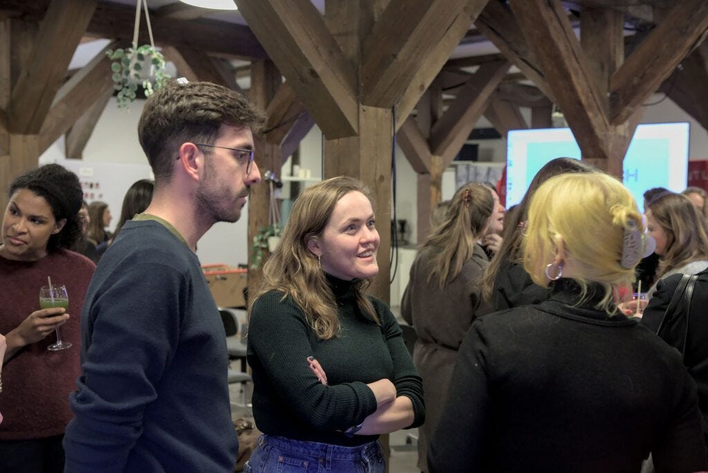 Three participants of the launch event of the Nordic Women's Health Hub engaged in conversation. Credit: Beau Ambut, CC BY-SA.