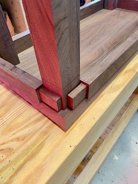 Making the legs involves laying out and cutting the mortises, cutting the tenons in the aprons, and then cutting the tapers on the legs