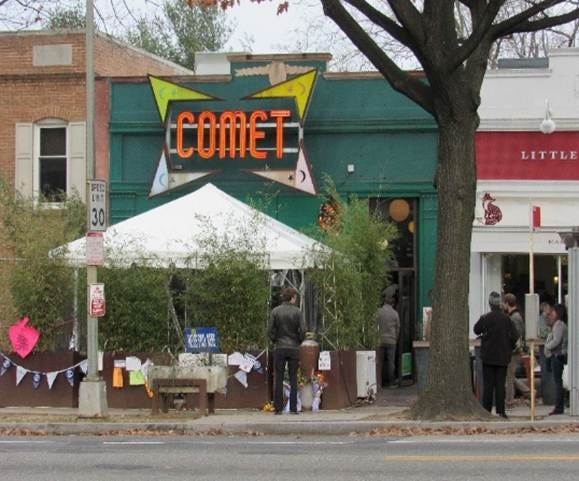 A group of people standing outside a restaurant

AI-generated content may be incorrect.