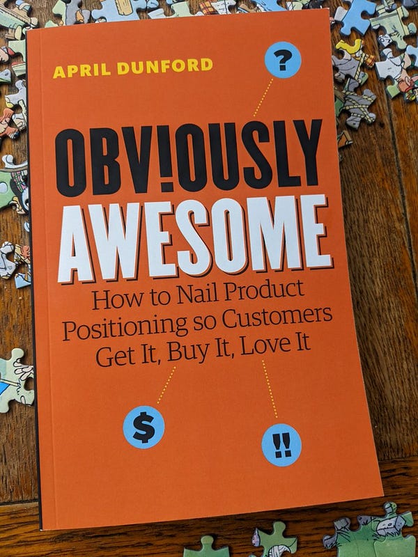 Photo of Obviously Awesome, a book by April Dubford. Lying slightly incongruously on unfinished jigsaw pieces 