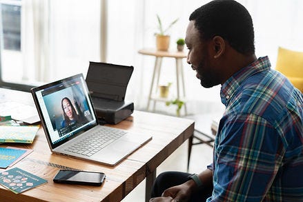 worker on a video meeting at home with a laptop