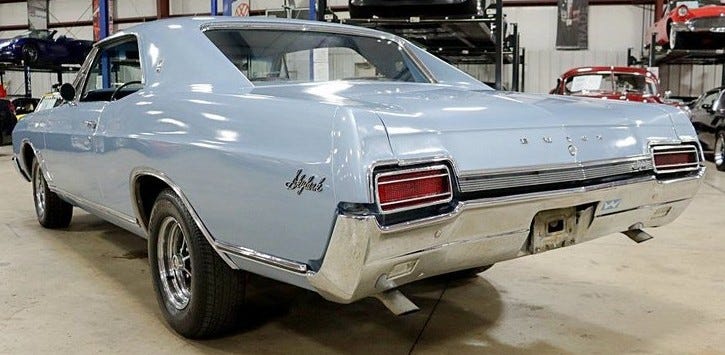 Light blue 1967 Buick Skylark 2-door, view from left rear