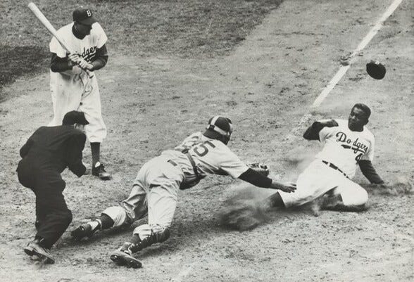 Two black & white photos of Jackie Robinson sliding into home plate during a Brooklyn Dodgers baseball game