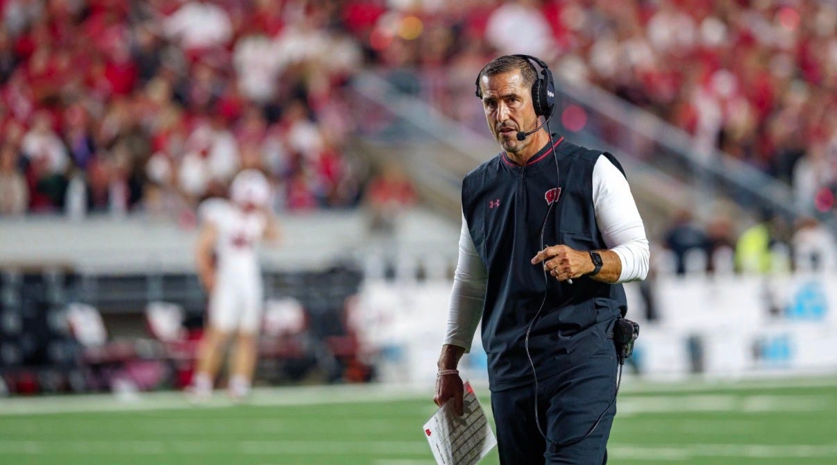 Wisconsin Badgers head coach Luke Fickell standing on the field during a game.