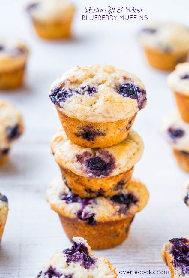 Extra Soft & Moist Blueberry Muffins - No oil & almost no butter yet they're the moistest muffins ever! All those blueberries make them impossible to resist! three homemade blueberry muffins stacked on top of each other