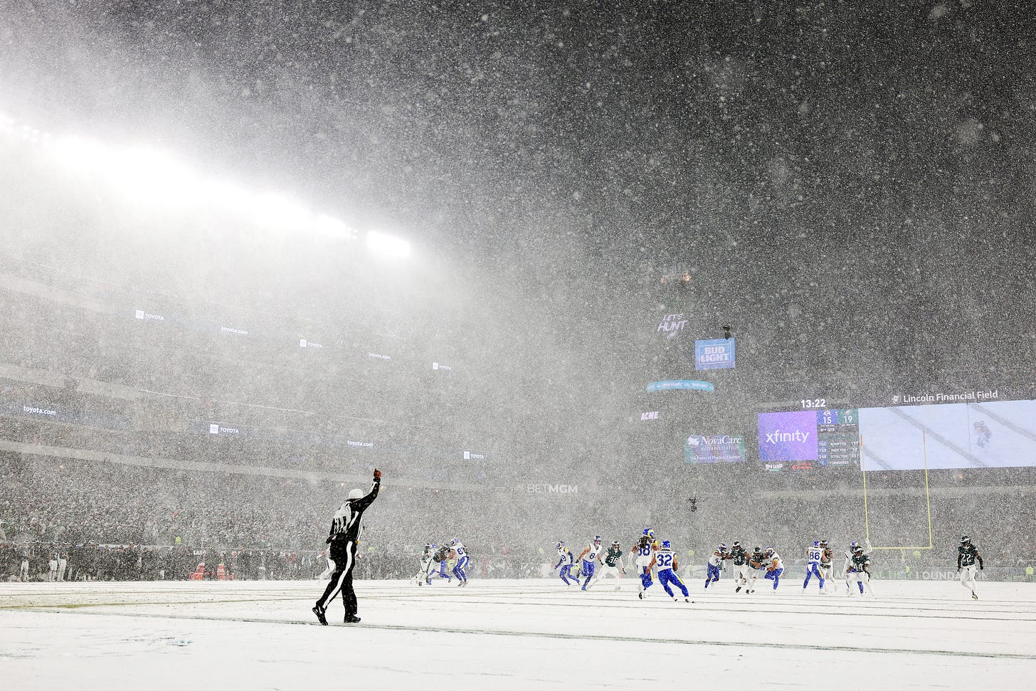 Snow falls as teams play American Football Snow falls as teams play American Football