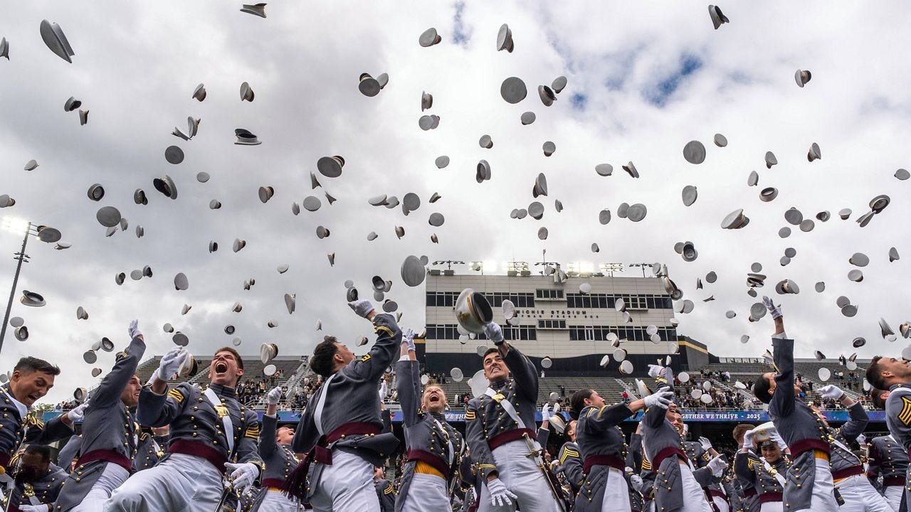 United States Military Academy graduating cadets throw their hats in the air at the end of commencement ceremonies in West Point, N.Y., Saturday, May 24, 2025. (AP Photo/Adam Gray)