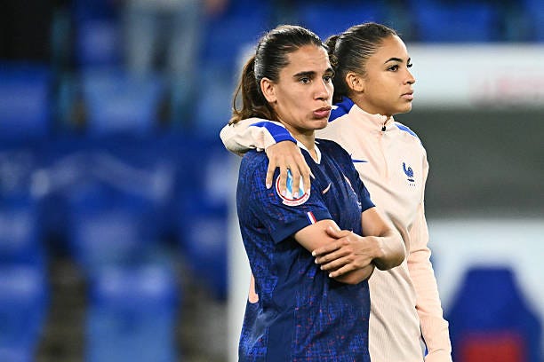France's midfielder Amel Majri and France's forward Delphine Cascarino react at the end of the UEFA Women's Euro 2025 quarter finals football match... France's midfielder Amel Majri and France's forward Delphine Cascarino react at the end of the UEFA Women's Euro 2025 quarter finals football match...