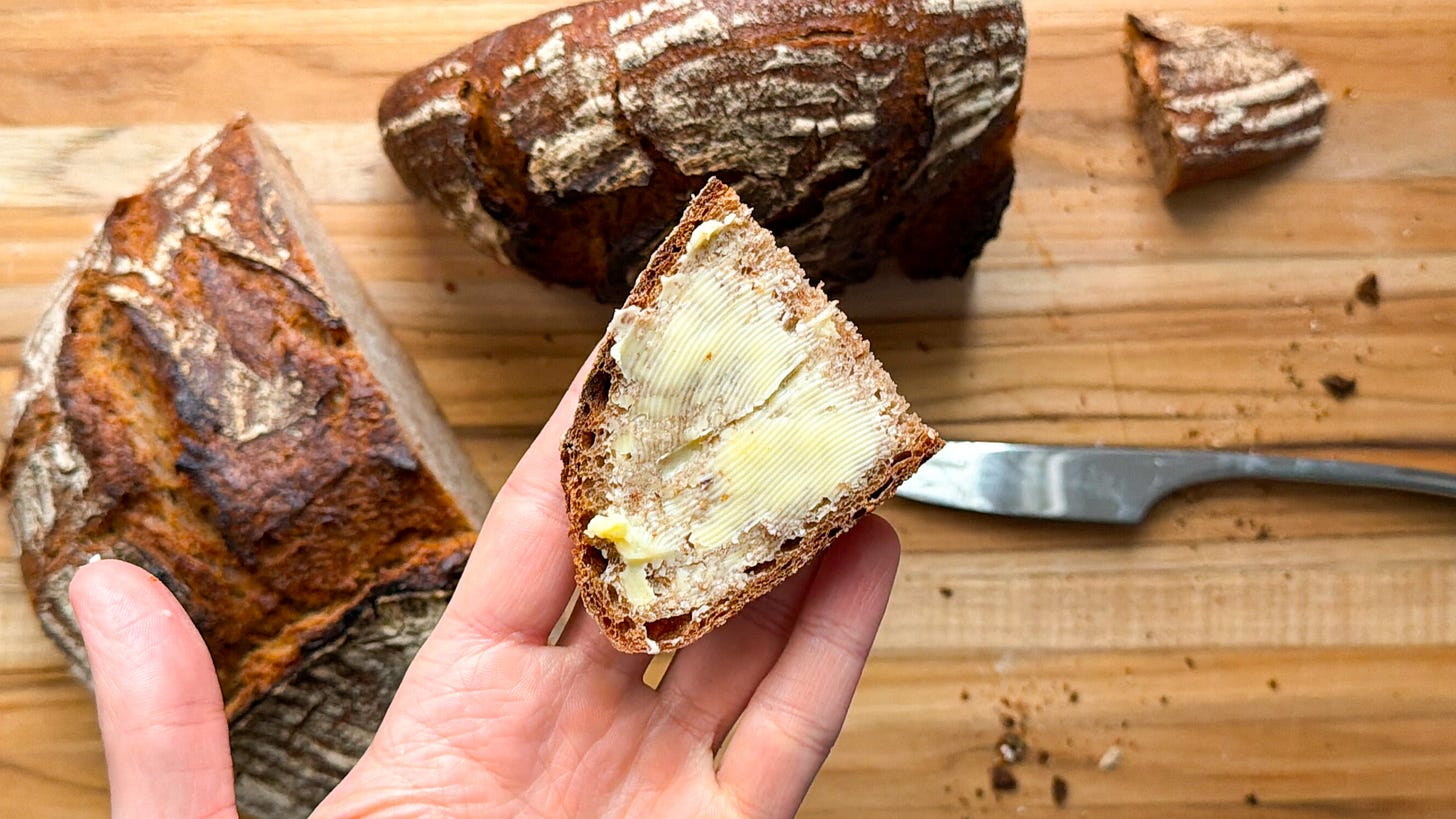 A slice of rye mixed bread with butter. A slice of rye mixed bread with butter.