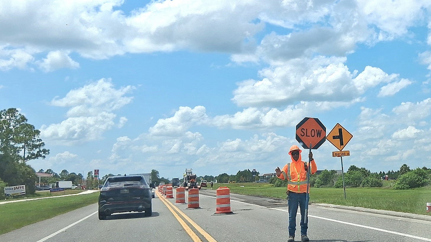 Construction crews on St. Johns Heritage Parkway directing traffic near the Emerson Drive intersection as infrastructure improvements begin. Construction crews on St. Johns Heritage Parkway directing traffic near the Emerson Drive intersection as infrastructure improvements begin.