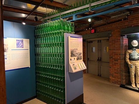 bottles, glassware, neon sign, exhibits, displays