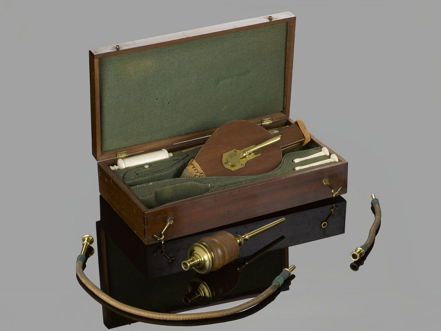 First aid kit in wooden case for resuscitation, first half 19th century. Contains seven nozzles, one pair of bellows, three flexible tubes, one large metal nozzle and one large metal and wood nozzle.