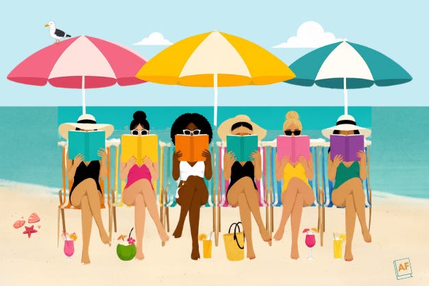 six women reading books at the beach