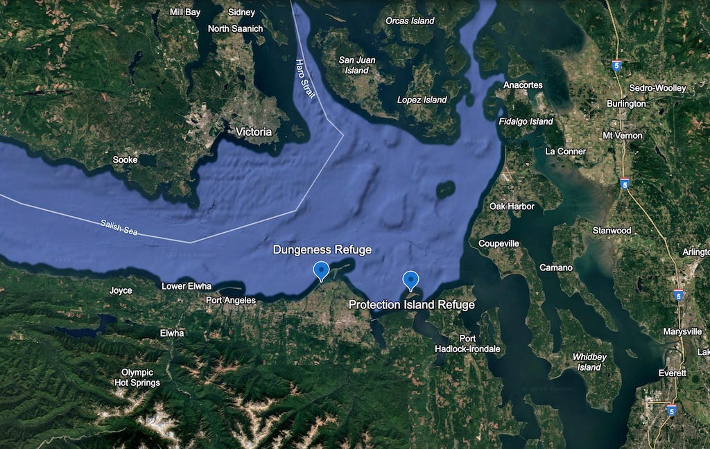 Satellite map of Puget Sound region showing Dungeness Refuge and Protection Island Refuge locations marked with blue pins. Map includes surrounding cities, islands, and waterways in Washington State and southern British Columbia Satellite map of Puget Sound region showing Dungeness Refuge and Protection Island Refuge locations marked with blue pins. Map includes surrounding cities, islands, and waterways in Washington State and southern British Columbia