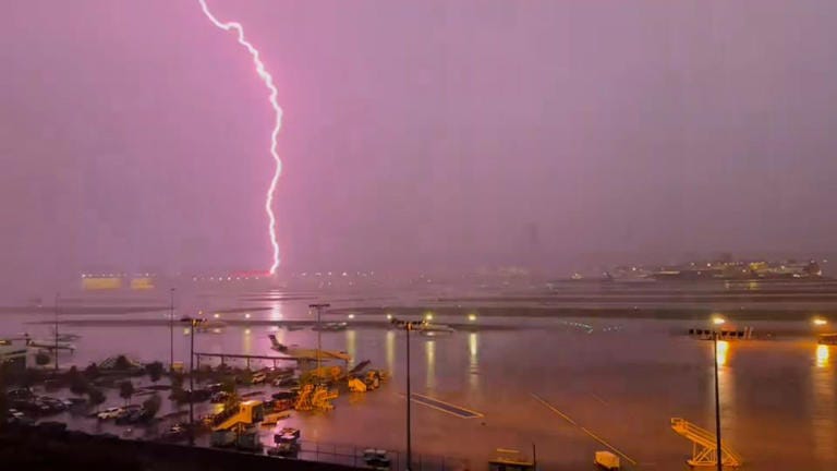 A lightning strike is seen from Atlanta’s Hartsfield-Jackson International Airport on Friday.