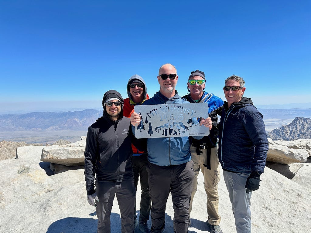 Team celebrates reaching the summit of Mount Whitney