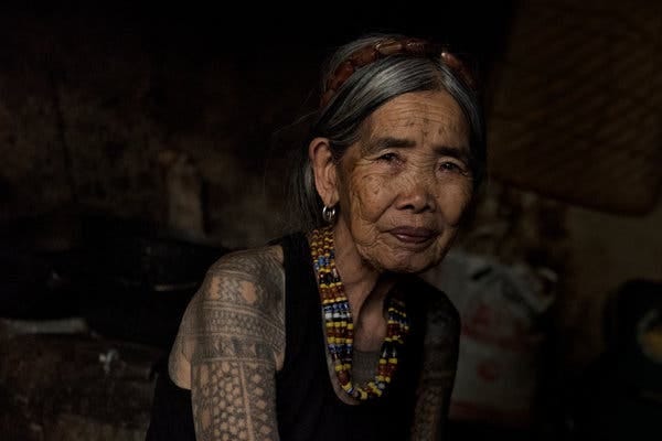 Maria Fang-od Oggay at her home in the village of Buscalan, in the northern Philippines, last week. She belongs to the last generation of her ethnic group bearing a full set of traditional tattoos and is one of the few who remember how they are done.