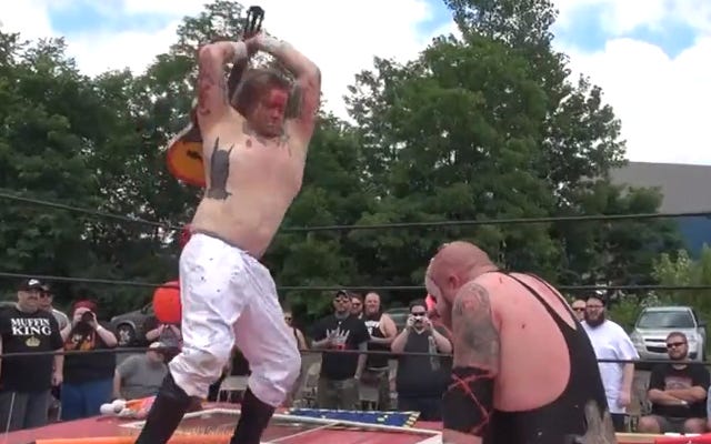 [Screenshot: Bryant Woods hammers a kenzan into Horror's head with a guitar]