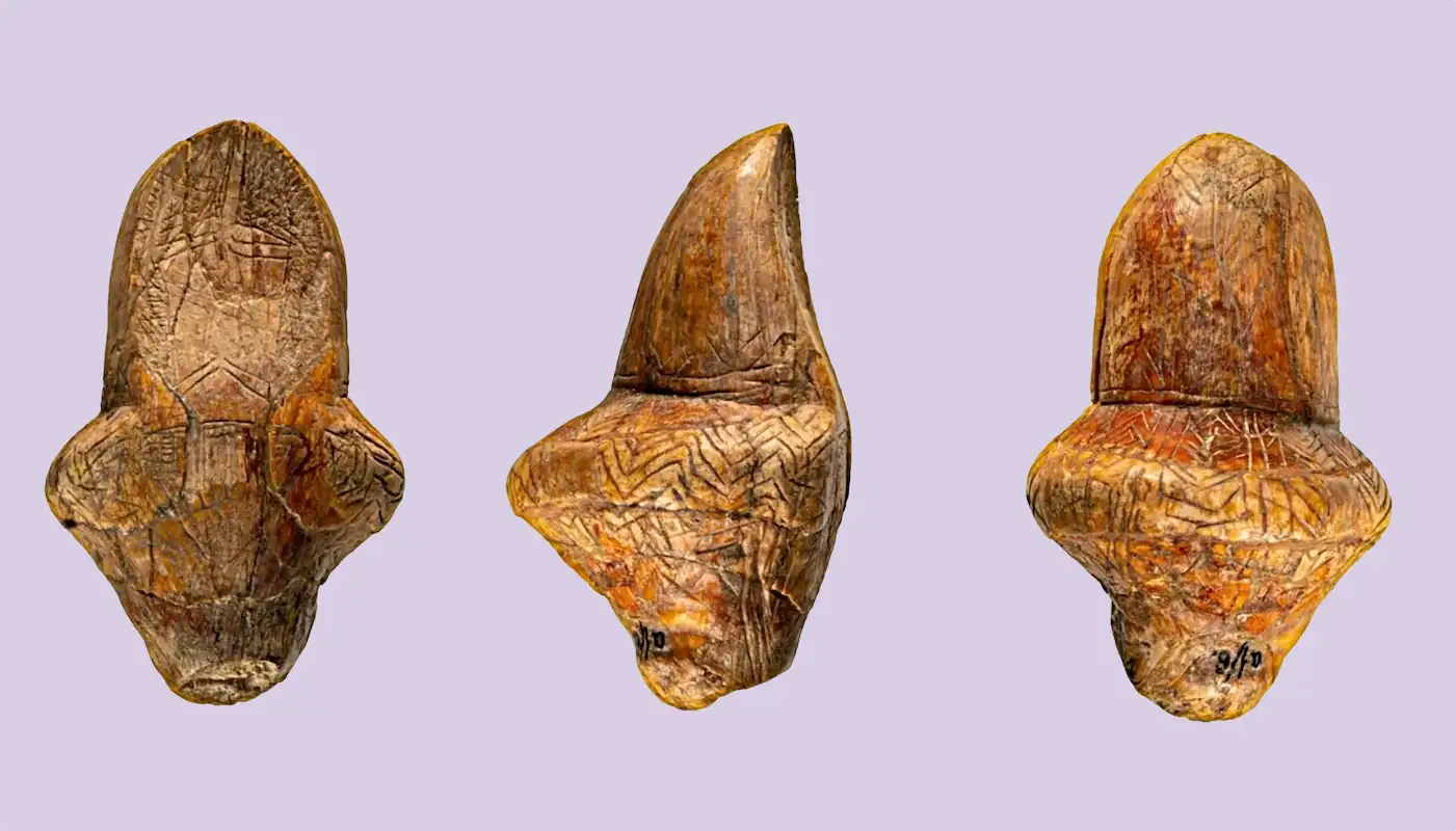 An engraved ivory figurine from Mizyn, Ukraine, seen from three sides. An engraved ivory figurine from Mizyn, Ukraine, seen from three sides.