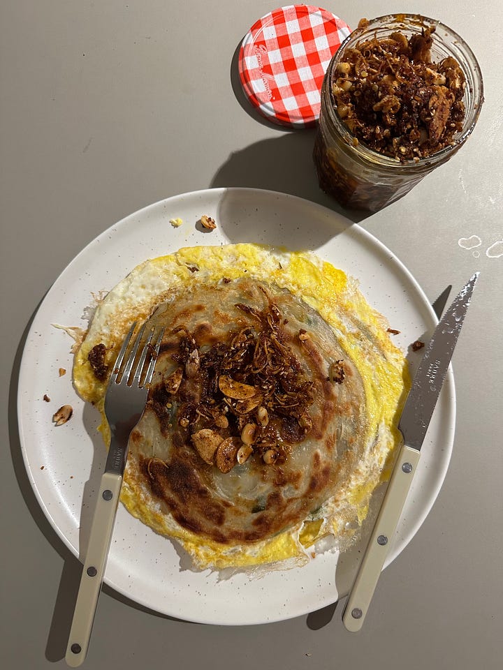 left: Chinese scallion pancake - I get a pack, frozen, and heat one up on a pan with oil and add an egg with a spoon-full of my homemade chili crisp; right: avocado on toast and chili crisp (would be even better with some homemade pickle onion)