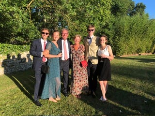 A group of people posing for a photo

Description automatically generated