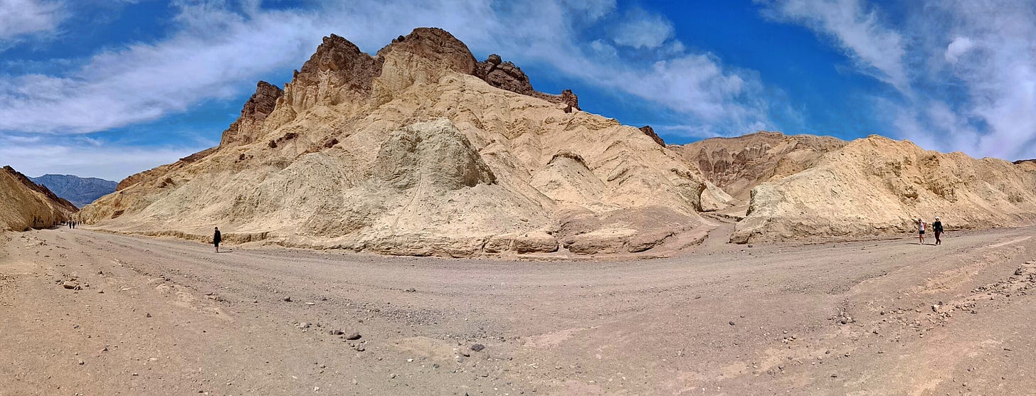 May be an image of 3 people and mountain